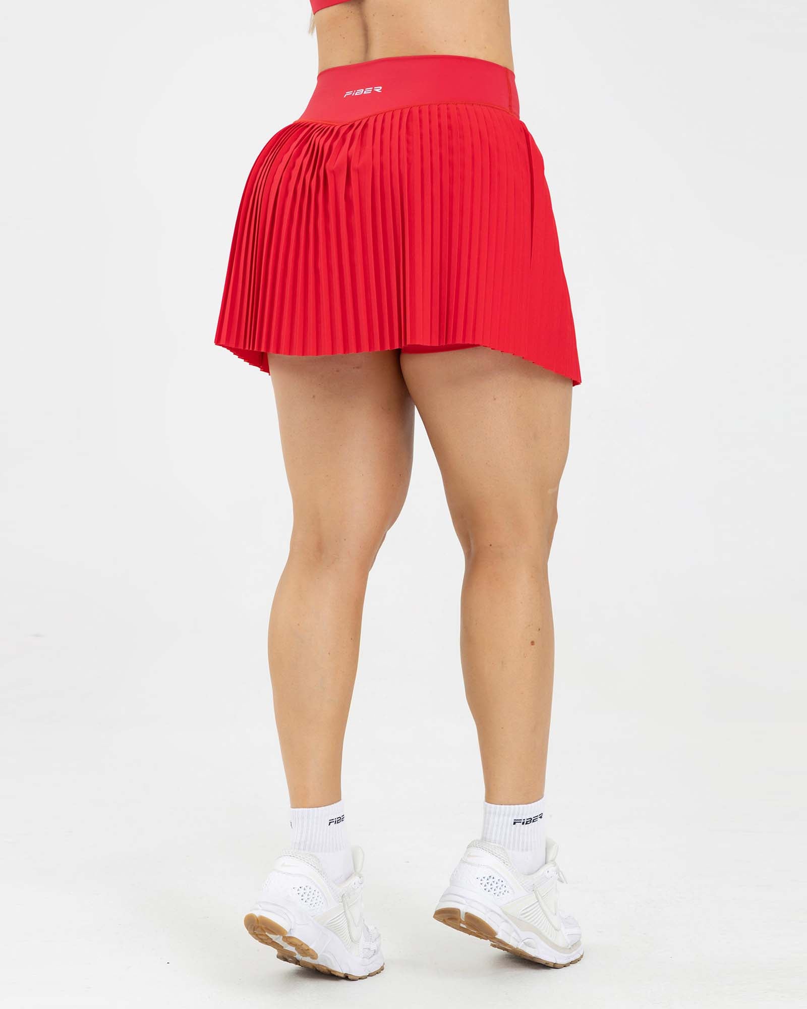 Falda short plisada match rojo scarlet FIBER