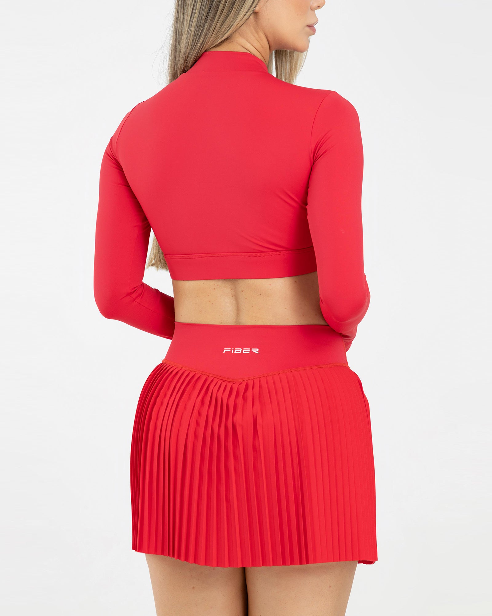 Top manga larga zip rojo scarlet match FIBER