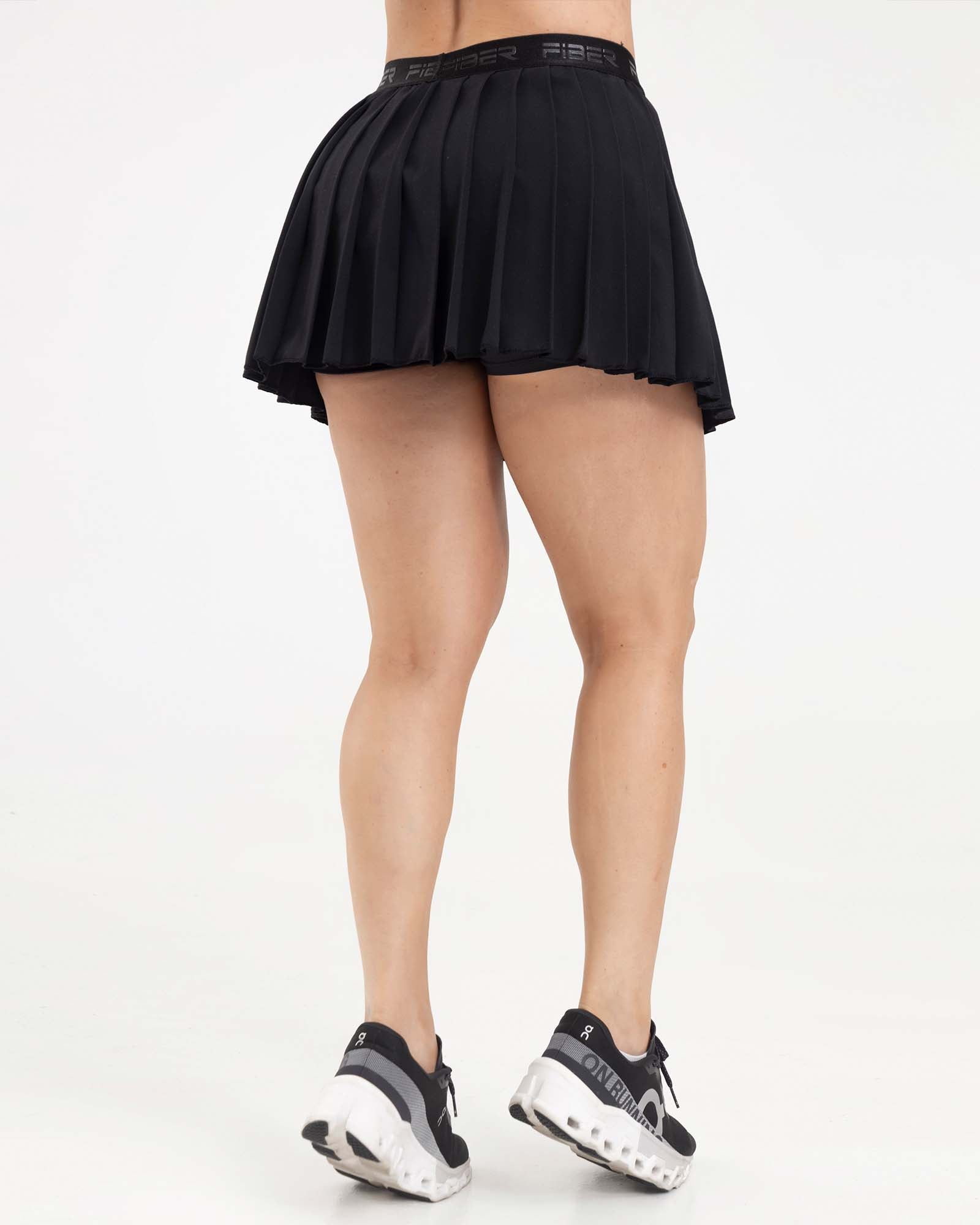 Falda plisada branded negro eterea FIBER