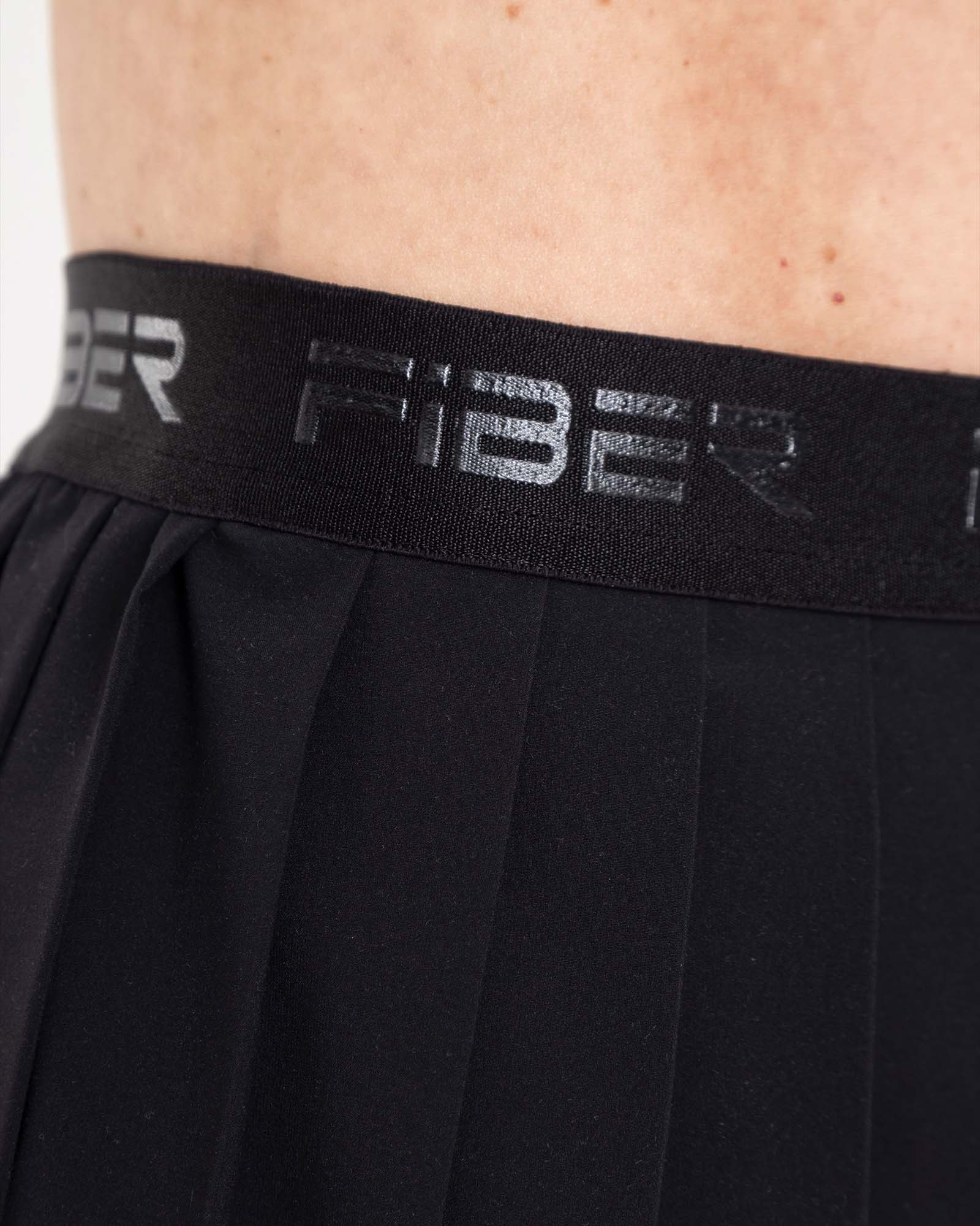 Falda plisada branded negro eterea FIBER