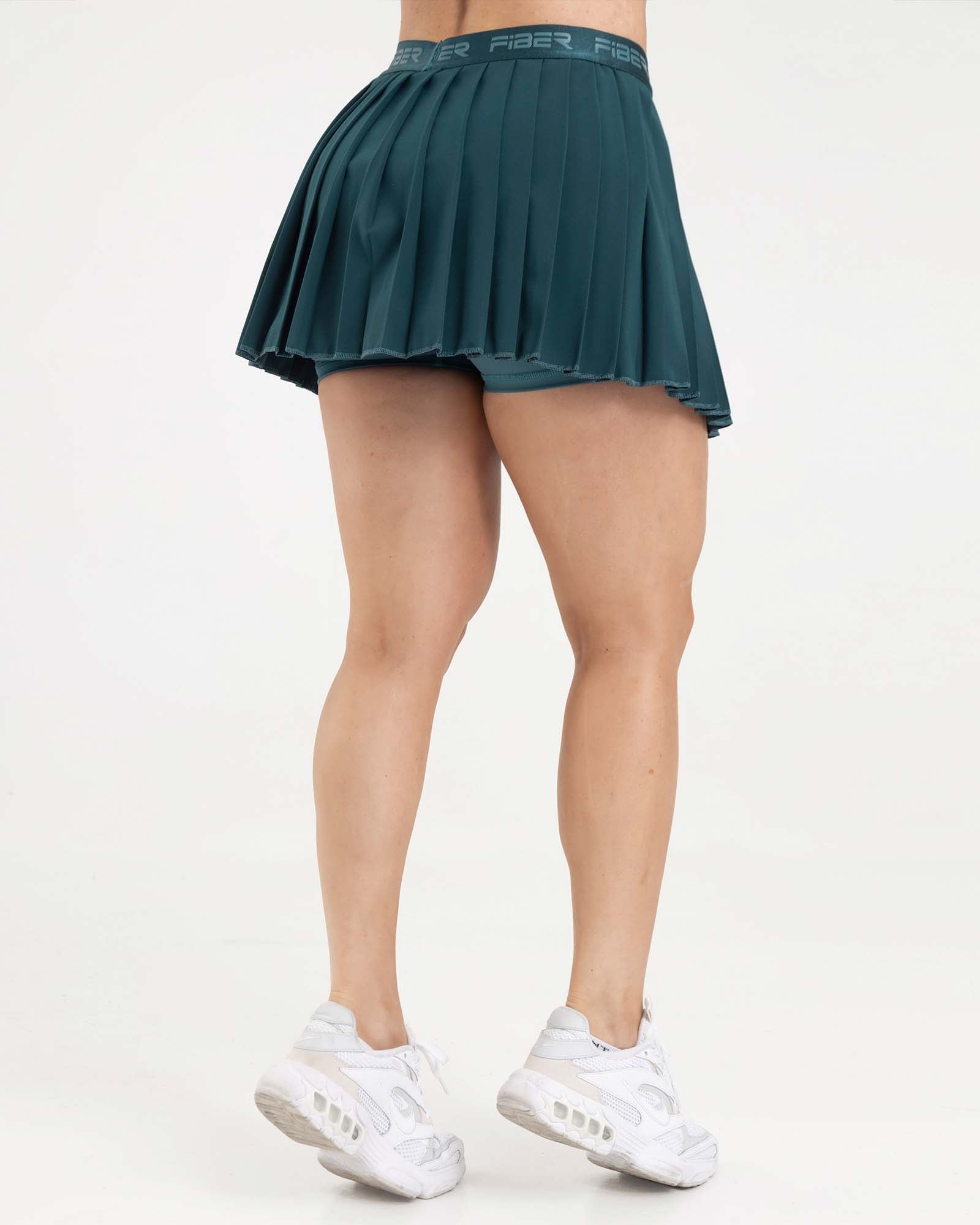 Falda plisada branded verde esmeralda eterea FIBER