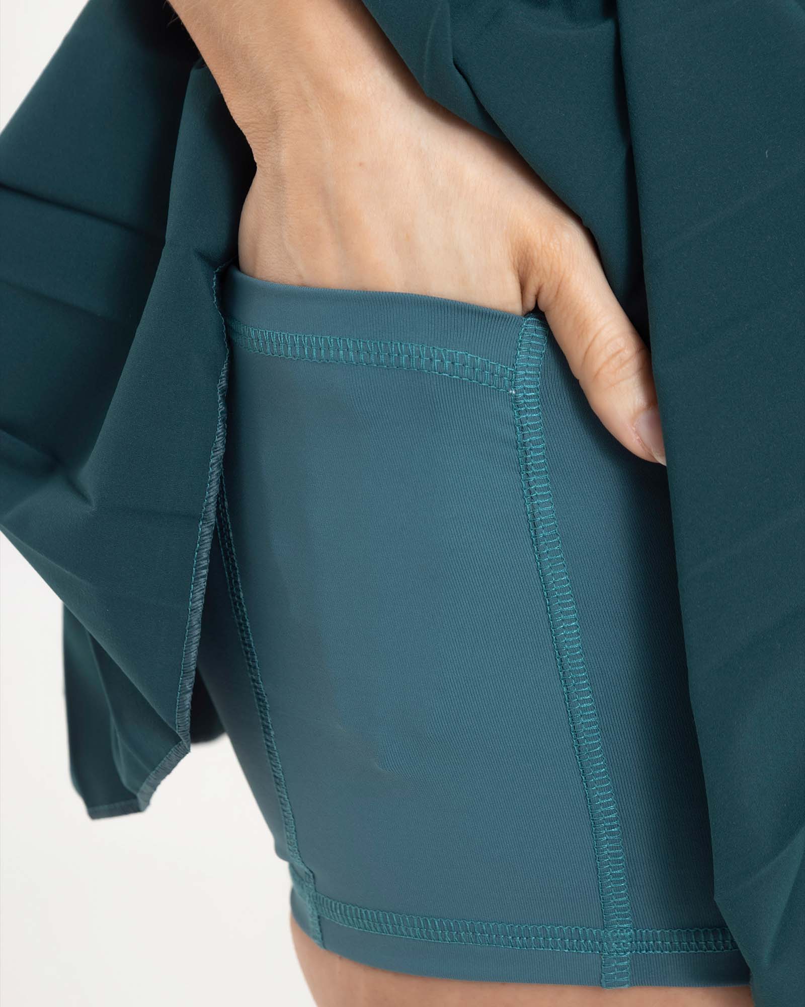 Falda plisada branded verde esmeralda eterea FIBER